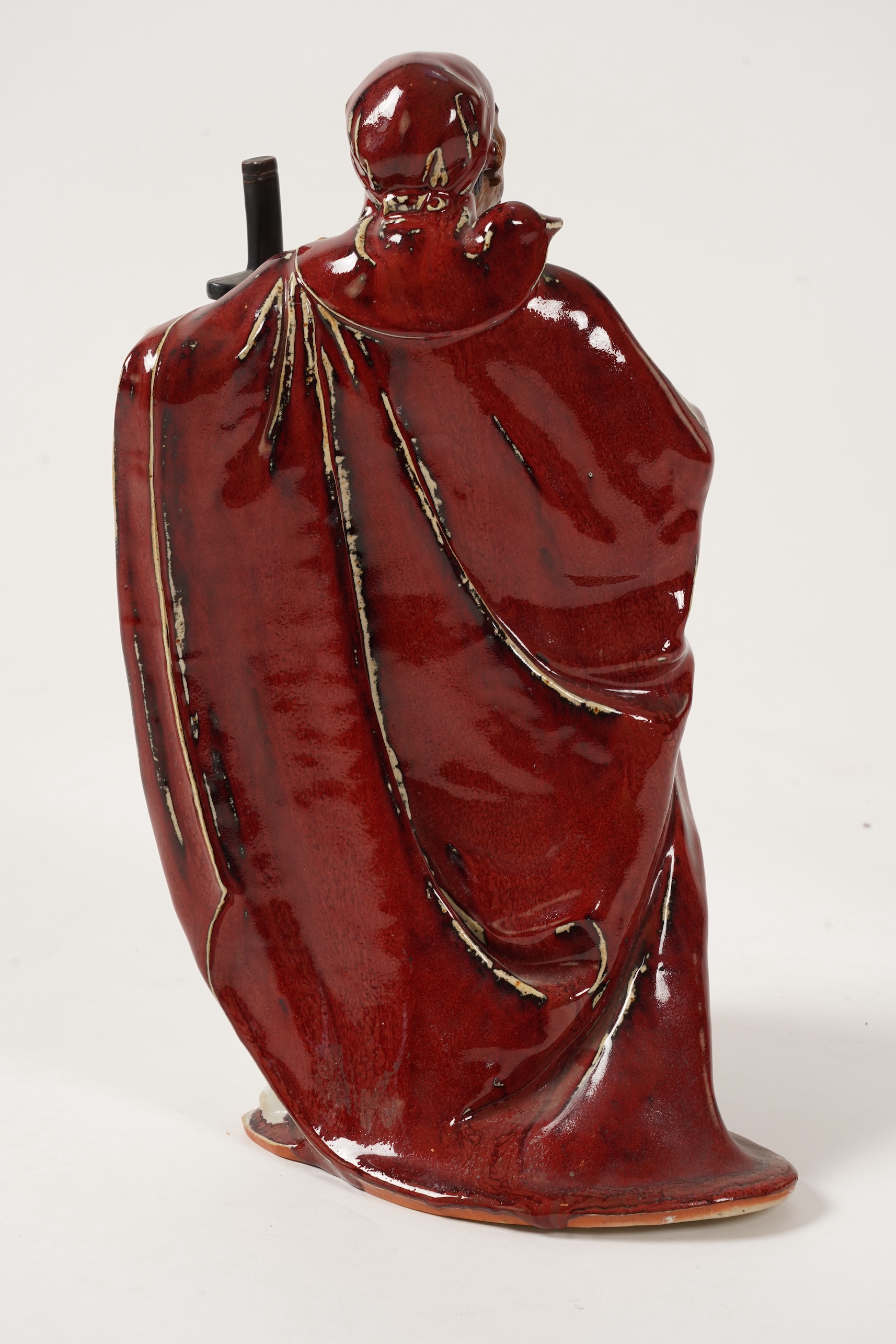 A large Chinese Shiwan stoneware figure of a warrior, 20th century